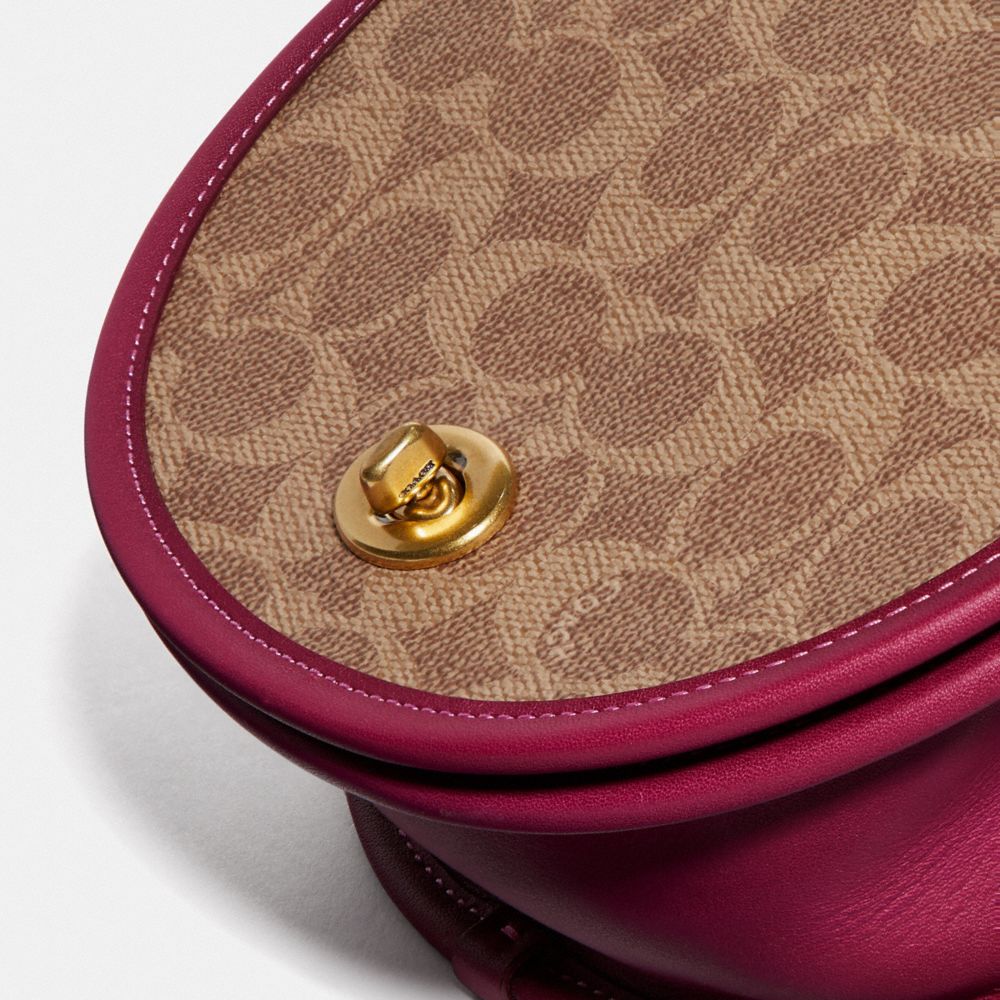 COACH®,Turnlock Saddle Crossbody In Signature Canvas,,Closer View