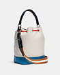 COACH®,JES DRAWSTRING BUCKET BAG IN COLORBLOCK WITH HORSE AND CARRIAGE,Leather,Silver/Chalk Multi,Angle View