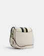 COACH®,JADE SADDLE BAG WITH VARSITY STRIPE,Leather,Medium,Silver/Chalk Pale Green Multi,Angle View