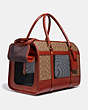 COACH®,PET CARRIER IN SIGNATURE CANVAS,Signature Coated Canvas,Brass/Tan/Rust,Angle View