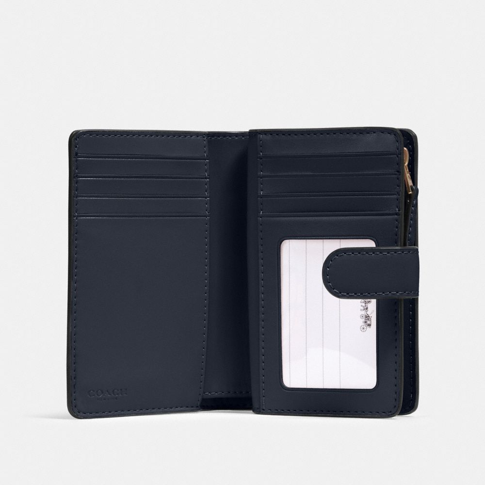 Medium Corner Zip Wallet In Signature Canvas