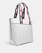COACH®,COACH │ MARVEL JES TOTE IN SIGNATURE CANVAS WITH PATCHES,pvc,Medium,Silver/Chalk Multi,Angle View