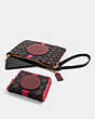 COACH®,DEMPSEY GALLERY POUCH IN SIGNATURE JACQUARD WITH STRIPE AND COACH PATCH,cotton,Gold/Black Wine Multi,Angle View
