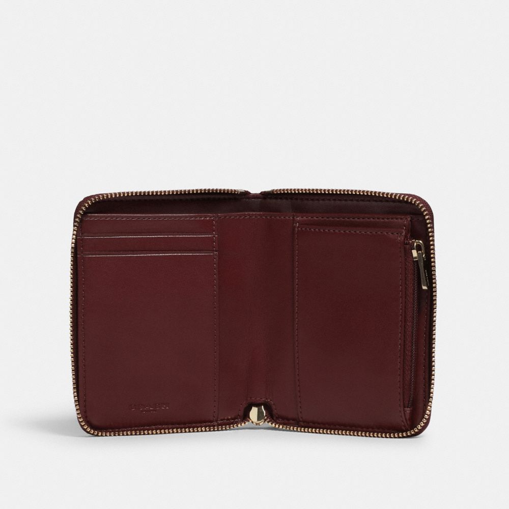 Coach small wallet zip around hot sale