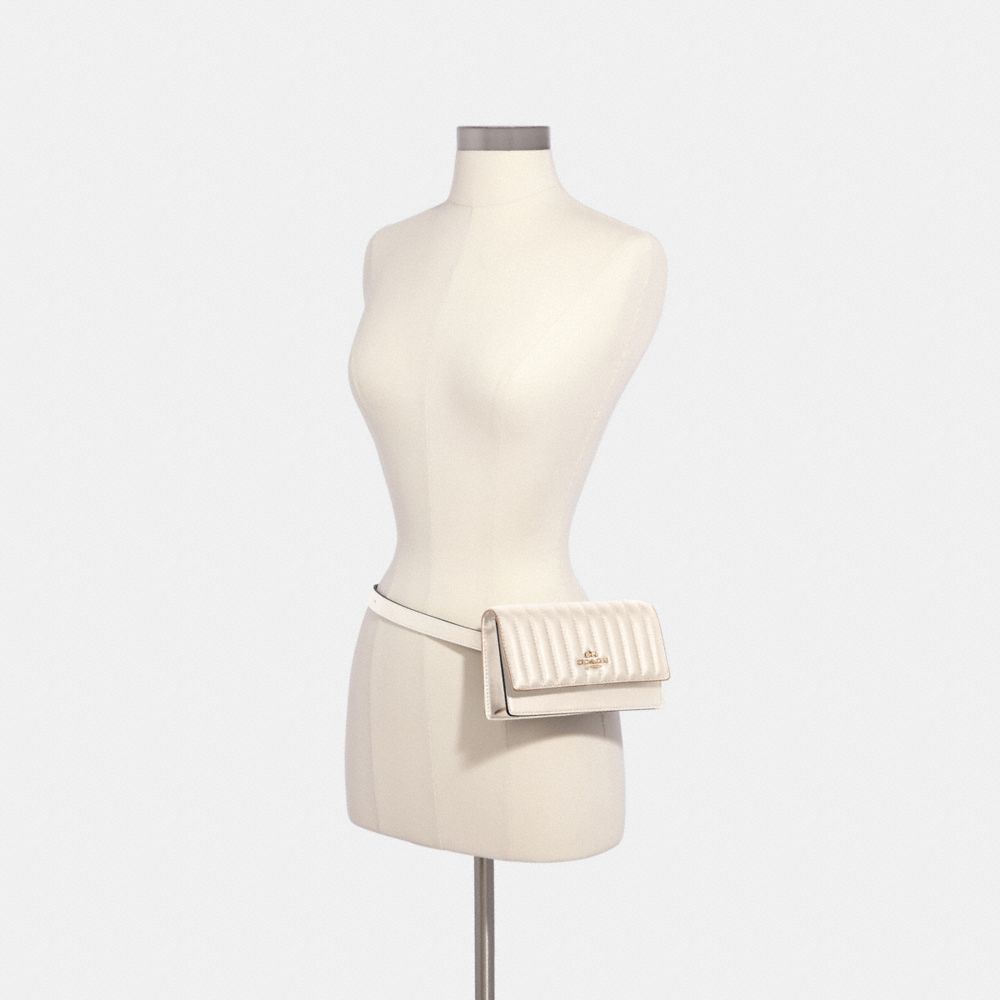 Flap belt outlet bag