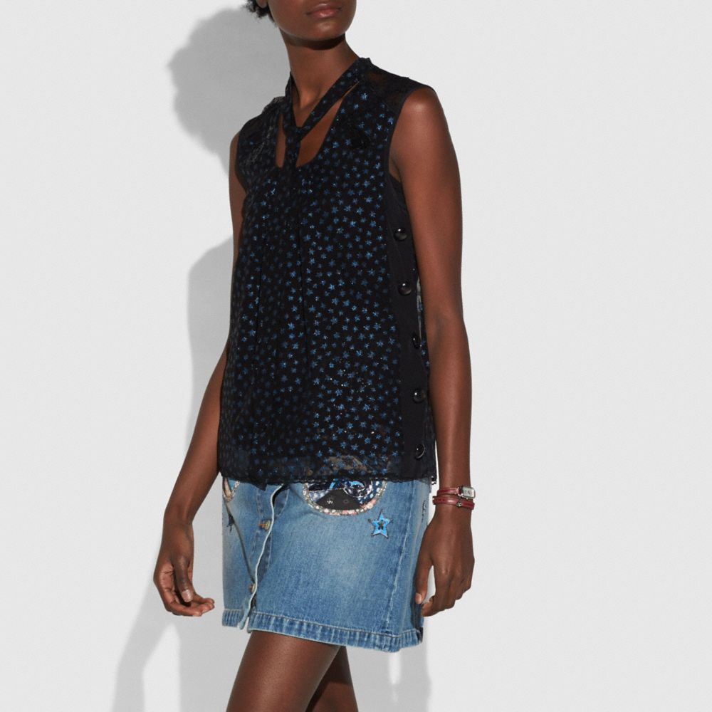 Star Print Sleeveless Tie Neck Blouse