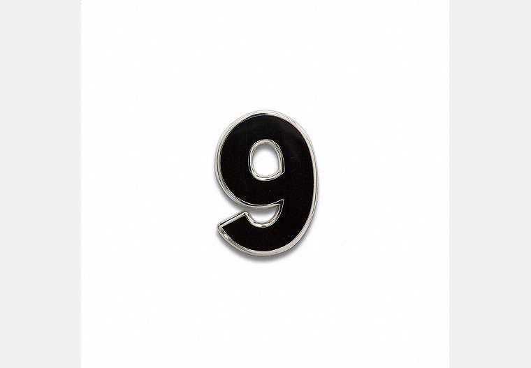 COACH®,Number 9 Souvenir Pin,Metal,Black,Front View