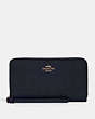 COACH®,LARGE PHONE WALLET IN SIGNATURE LEATHER,Gold/Midnight,Front View