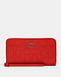 COACH®,LARGE PHONE WALLET IN SIGNATURE LEATHER,Gunmetal/Miami Red,Front View