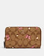 COACH®,MEDIUM ID ZIP WALLET IN SIGNATURE CANVAS WITH BUTTERFLY PRINT,Gold/Khaki Pink Multi,Front View