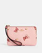 COACH®,CORNER ZIP WRISTLET WITH BUTTERFLY PRINT,pvc,Gold/Blossom/ Pink Multi,Front View