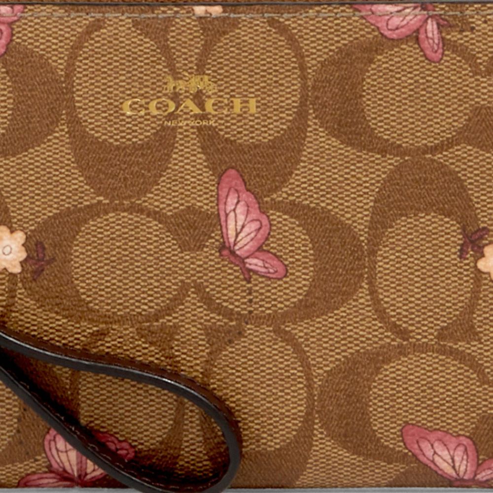 Coach pink 2024 butterfly wristlet