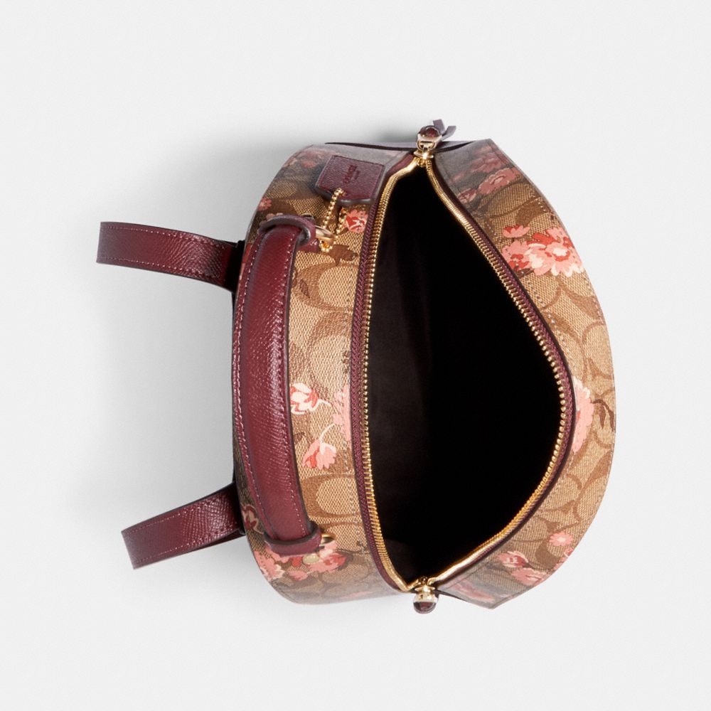 Dome crossbody in signature canvas best sale with prairie daisy cluster print