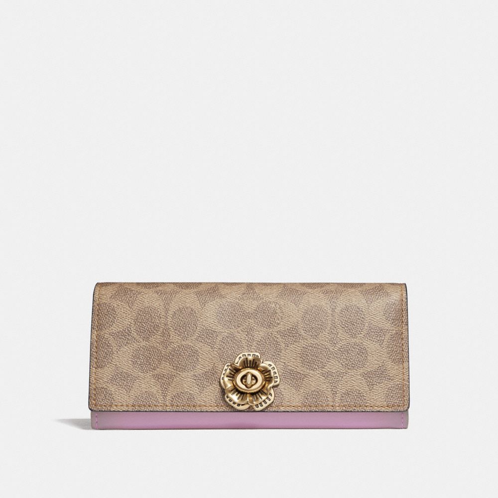 Coach envelope clutch in leather and coated canvas with logo