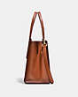 COACH®,CHARLIE CARRYALL IN SIGNATURE CANVAS,pvc,Large,Brass/Rust,Angle View
