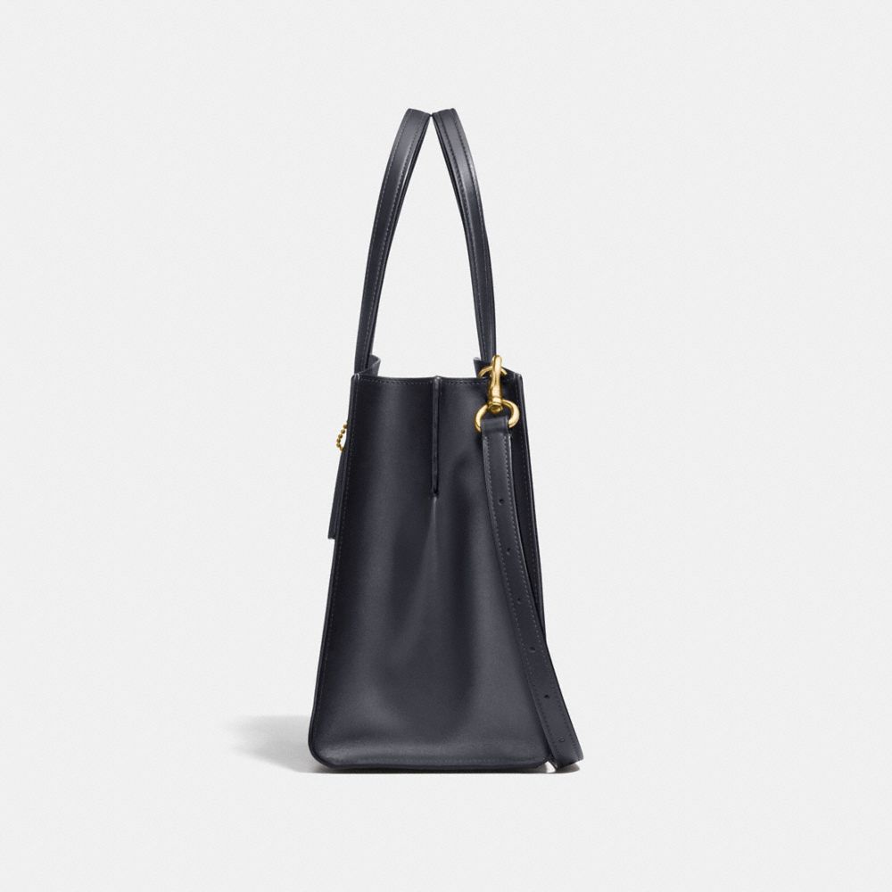 COACH®,Charlie Carryall In Signature Canvas,,Angle View