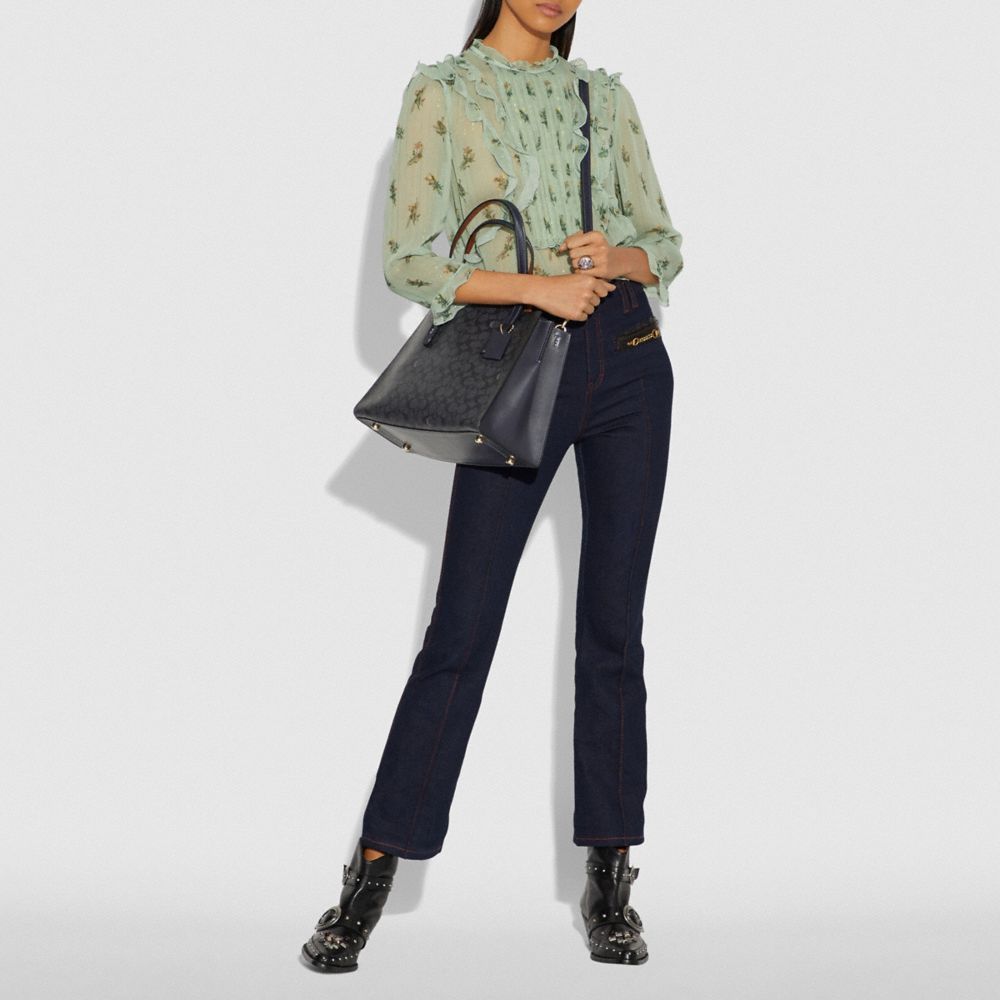 COACH®,Charlie Carryall In Signature Canvas,,Detail View