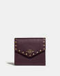 COACH®,SMALL WALLET WITH RIVETS,Leather,Brass/Oxblood,Front View