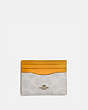 COACH®,CARD CASE IN COLORBLOCK SIGNATURE CANVAS,Signature Coated Canvas,Brass/Chalk Pollen,Front View