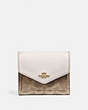 COACH®,SMALL WALLET IN COLORBLOCK SIGNATURE CANVAS,pvc,Brass/Tan/Chalk,Front View
