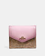 COACH®,SMALL WALLET IN COLORBLOCK SIGNATURE CANVAS,pvc,Brass/Tan/Blossom,Front View