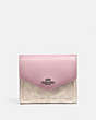 COACH®,SMALL WALLET IN COLORBLOCK SIGNATURE CANVAS,pvc,Light Antique Nickel/Sand Aurora,Front View