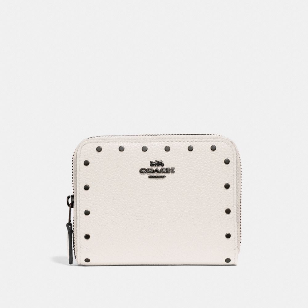 Petit portefeuille zippé avec rivets