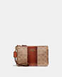 COACH®,SMALL WRISTLET IN COLORBLOCK SIGNATURE CANVAS,canvas,Brass/Tan/Rust,Front View