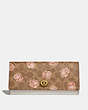 COACH®,ENVELOPE WALLET IN SIGNATURE ROSE PRINT,Coated Canvas,Brass/Tan,Front View