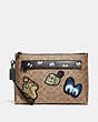 COACH®,DISNEY X COACH CARRYALL POUCH WITH SIGNATURE PATCHWORK,Coated Canvas,KHAKI,Front View