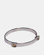 COACH®,SCULPTED SIGNATURE TENSION HINGED BANGLE,Metal,Silver/Gold,Front View