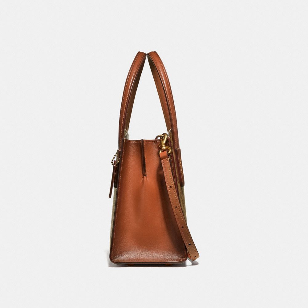 COACH®,Charlie Carryall 28 In Signature Canvas,,Angle View