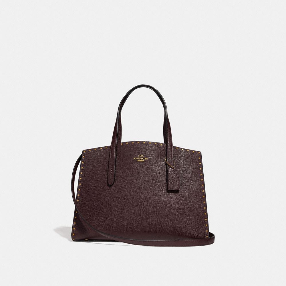 Coach charlie carryall store with rivets