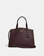 COACH®,CHARLIE CARRYALL WITH RIVETS,Leather,Large,Brass/Oxblood,Front View