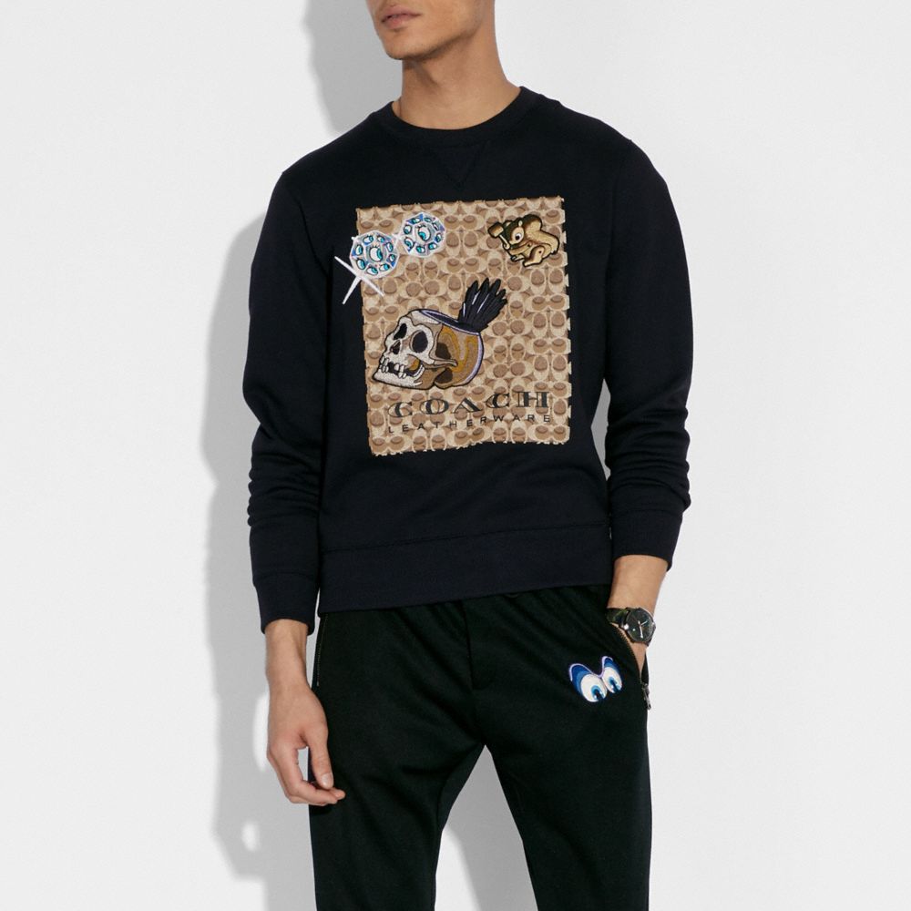 Sweat-shirt signature Disney X Coach avec écussons