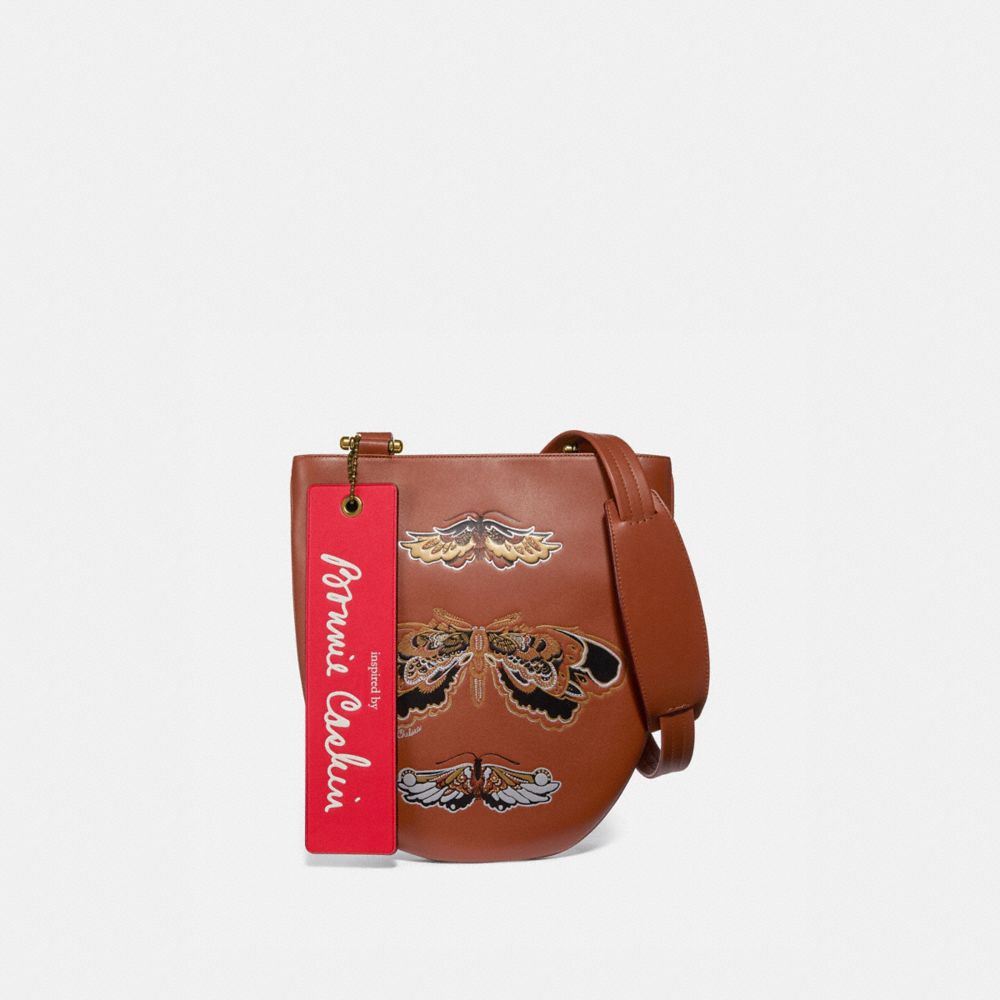 Coach sling on sale bag with tattoo