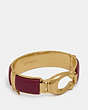 COACH®,WRAPPED SCULPTED SIGNATURE BANGLE,Plated Brass,GD/Scarlet,Front View
