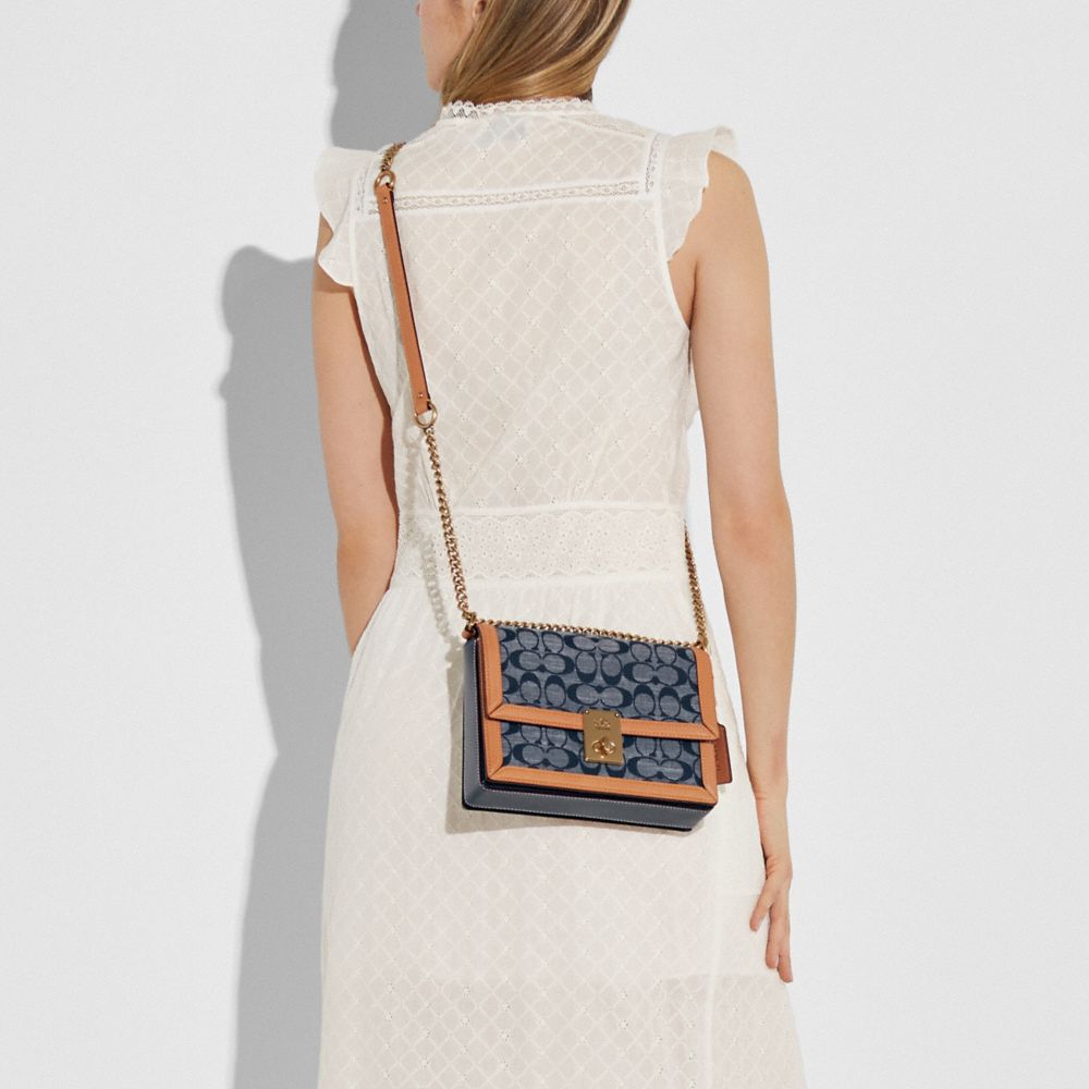 hutton shoulder bag in signature chambray