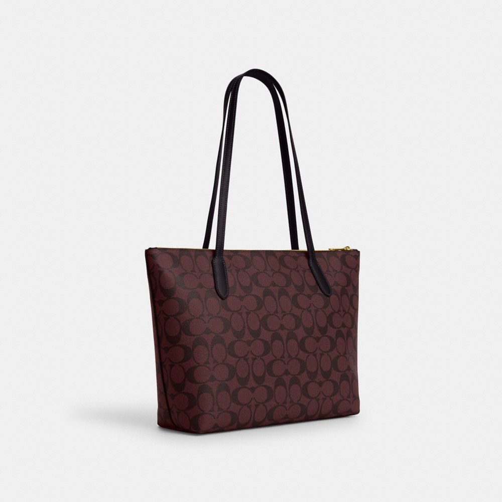 COACH®,ZIP TOP TOTE BAG IN SIGNATURE CANVAS,Signature Canvas,Large,Everyday,Gold/Oxblood Multi,Angle View