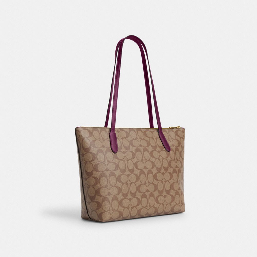 COACH®,ZIP TOP TOTE BAG IN SIGNATURE CANVAS,Signature Canvas,Large,Everyday,Gold/Khaki/Deep Berry,Angle View