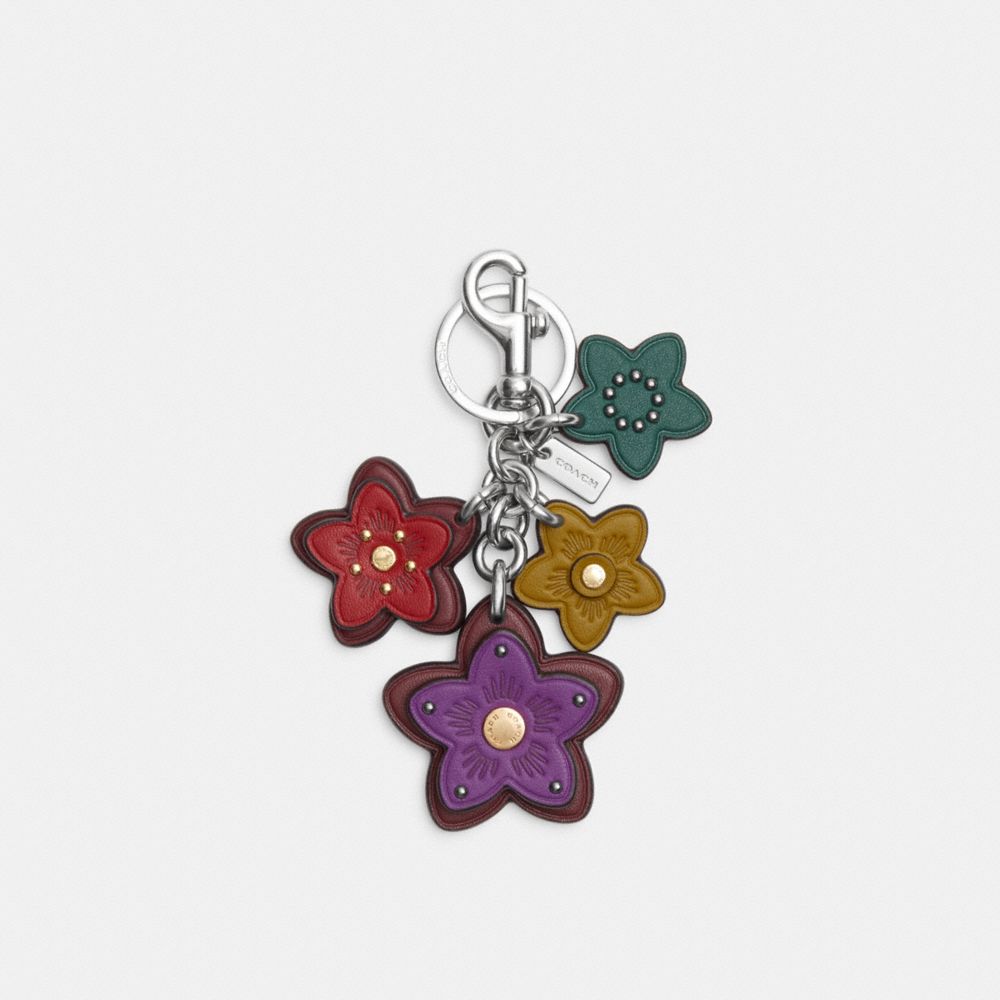 Shop Coach Wildflower bag charm in signature canvas (C4316) by