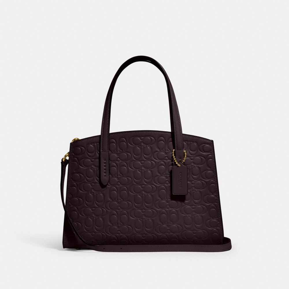 Coach charlie carryall deals 28 signature