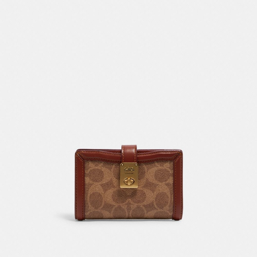 COACH®,HUTTON WALLET IN SIGNATURE CANVAS,Signature Coated Canvas/Smooth Leather,Mini,Brass/Tan/Rust,Front View