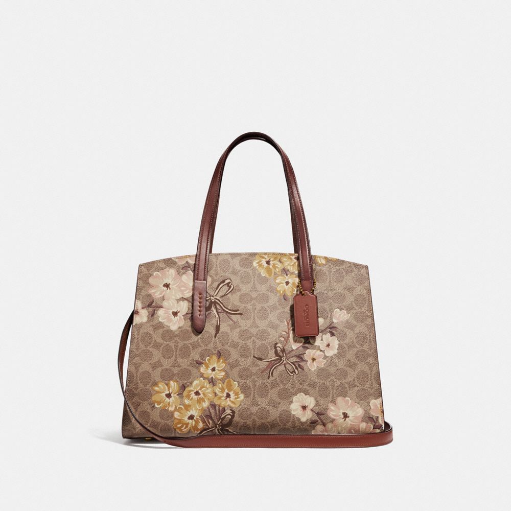 Coach coated canvas signature best sale charlie carryall