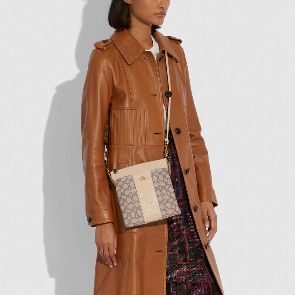 COACH®,KITT MESSENGER CROSSBODY IN SIGNATURE JACQUARD,Signature Jacquard,Small,Brass/Stone Ivory,Detail View