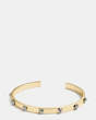 COACH®,DELICATE DAISY RIVET CUFF,Plated Brass,Gold/Silver,Front View