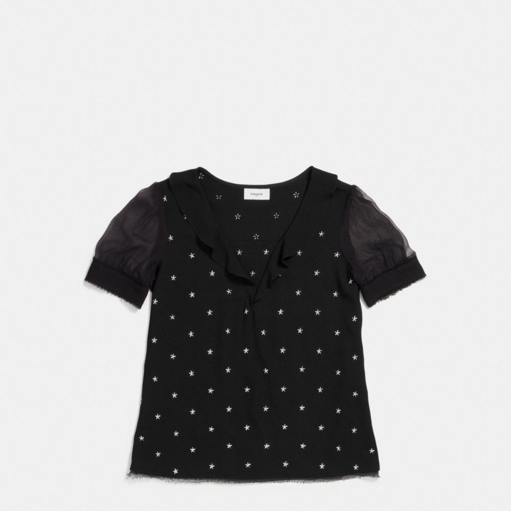 Haut avec clous étoiles