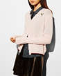 COACH®,V-NECK CARDIGAN WITH REXY PATCH,Cashmere Blend,Pale Tulip,Front View