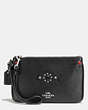 COACH®,SMALL WRISTLET IN POLISHED PEBBLE LEATHER WITH WESTERN RIVETS,Leather,Silver/Black,Front View