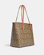 COACH®,CITY TOTE BAG IN SIGNATURE CANVAS,pvc,X-Large,Everyday,Im/Khaki/Light Coral,Angle View